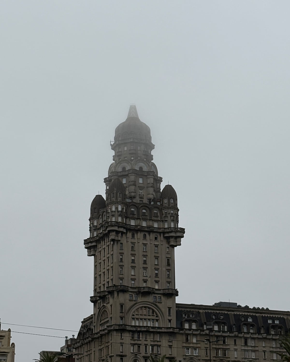 Palacio Salvo, Montevideo, in early-morning fog.