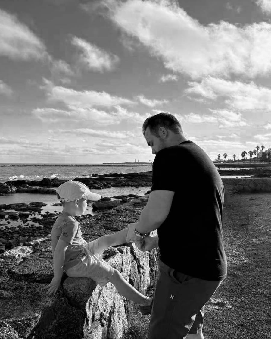 Ivan with his son on the rocks at the Montevideo coast.
